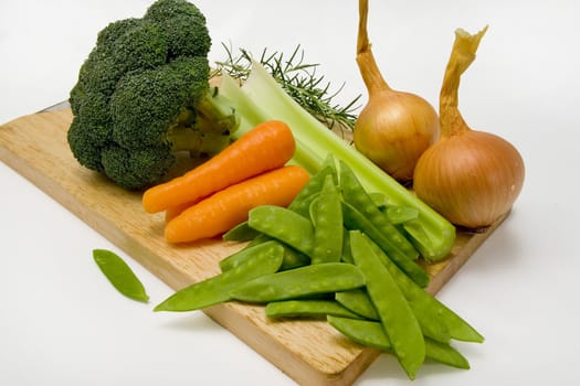 Vegetables on a chopping board ready to be prepared