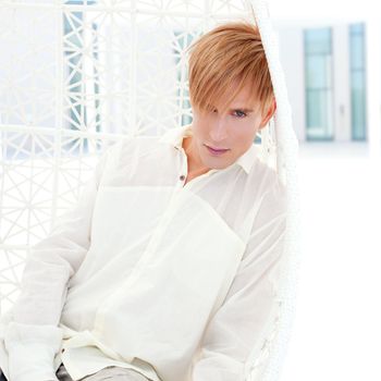 blond modern man portrait in summer terrace vampire inspiration