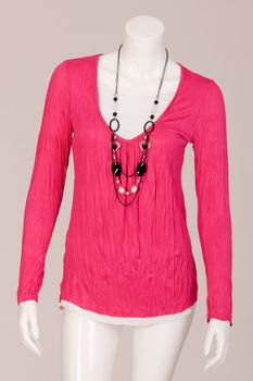 Mannequin dressed in a Pink shirt and fashionable chain