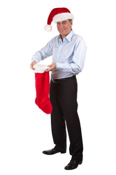 Full Length Portrait of Happy Smiling Middle Age Business Man in Santa Hat pleased with contents of Christmas Stocking Isolated