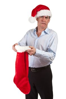 Middle Age Business Man in Santa Hat Horrified at contents of Christmas Stocking Isolated