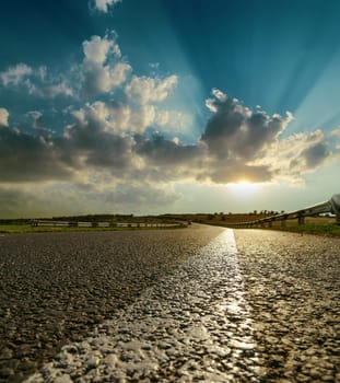 asphalt road closeup to sunset