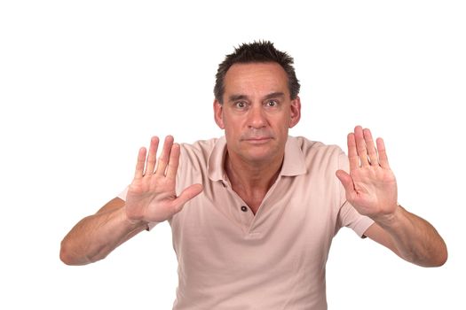 Attractive Middle Age Man Holding Up Hands to Signal Stop or Push Something Away Isolated