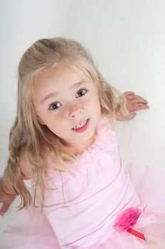 Studio shot of ballet dancer girl in pink