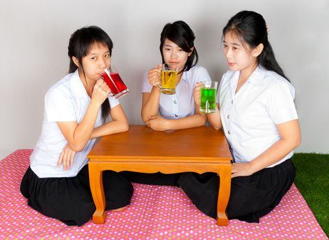 Asian Thai Students drinking colorful soda