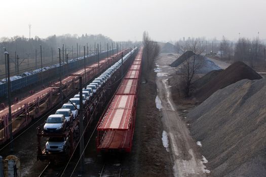 Freight trains with different cargo on the station
