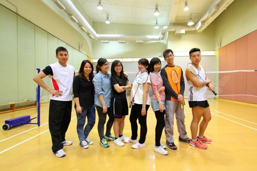 Asian friends playing badminton