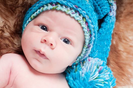 Shot of newborn baby lying on fur