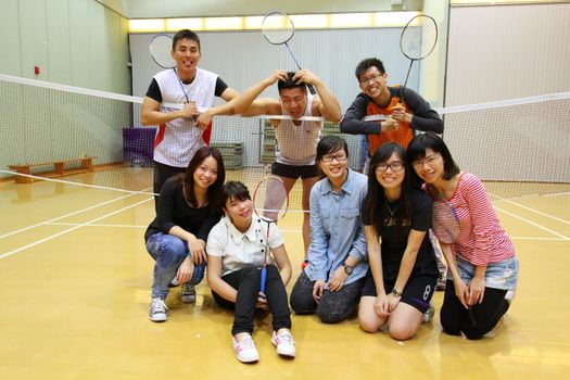 Asian friends playing badminton