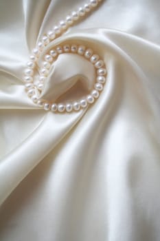 Smooth elegant white silk with pearls can use as wedding background