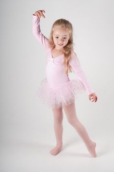 Studio shot of ballet dancer girl in pink