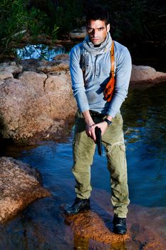 View of an treasure hunter, jungle adventurer type man.