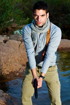 View of an treasure hunter, jungle adventurer type man.