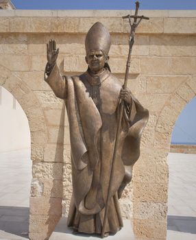 Bronze statue of pope Benedetto XVI at the view point at Sante Maria de Leuca, Apulia - Italy.