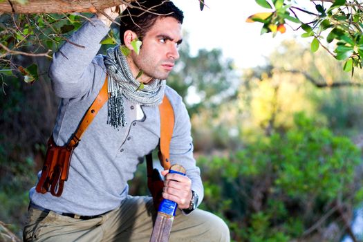 View of an treasure hunter, jungle adventurer type man.