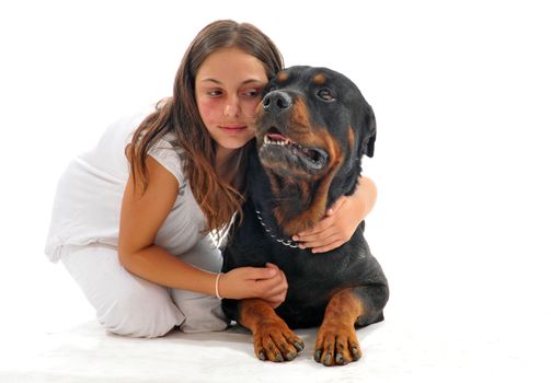 young teenager with a birthmark on the face and her best friend purebred rottweiler