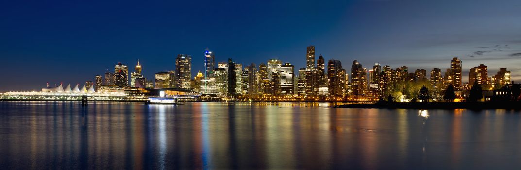 Vancouver BC Canada Skyline along False Creek from Stanley Park at Blue Hour Panorama