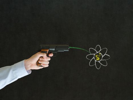 Business man, student or teacher pointing a gun with peace hippie flower on blackboard background