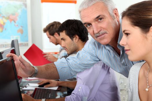 Older students using computers in the classroom