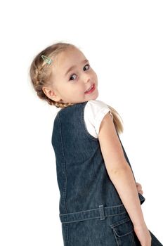 Studio portrait of little cute girl in denim dress