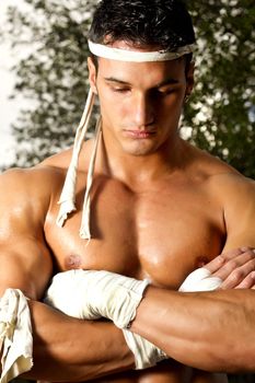 View of a fighter male meditating before the fight.