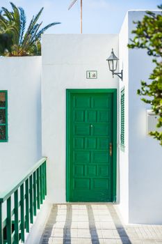 Green door of the typical Villas in Lanzarote, Canary islands, Spain