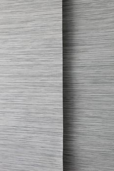 Close-up image of black, grey and white colored blinds.