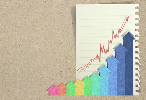 Conceptual Business charts with staple recycled paper craft stick