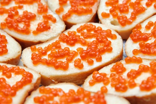 bread and butter with red caviar. Gourmet food