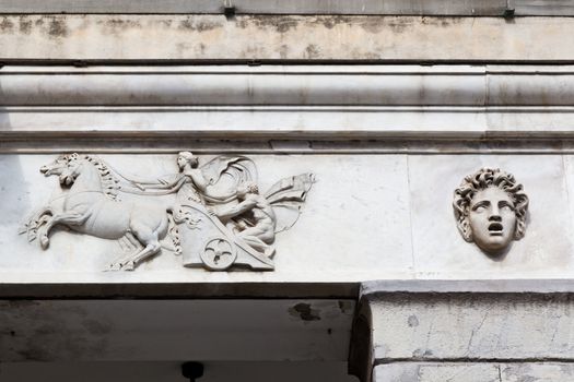 Marble Relief of Woman Driving Chariot in Genoa, Italy