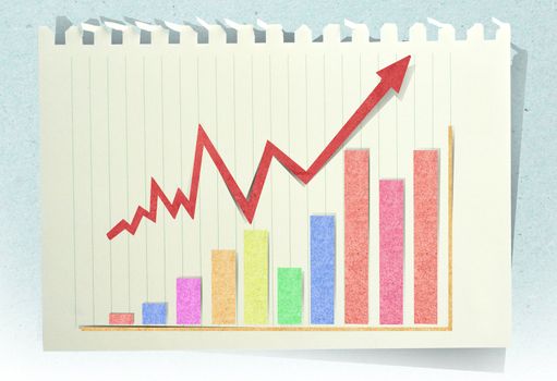 Conceptual Business charts with staple recycled paper craft stick