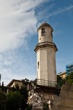 White Lighthouse Dominating on Genoa Cityscape, Italy