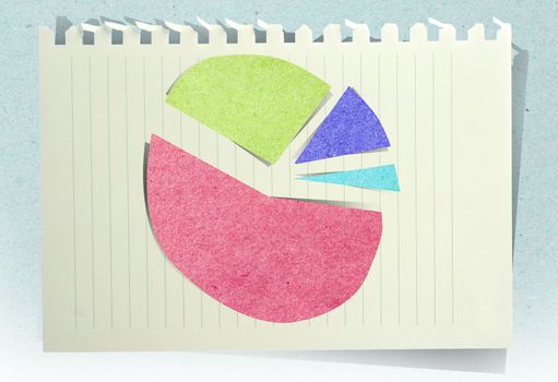 Conceptual Business charts with staple recycled paper craft stick