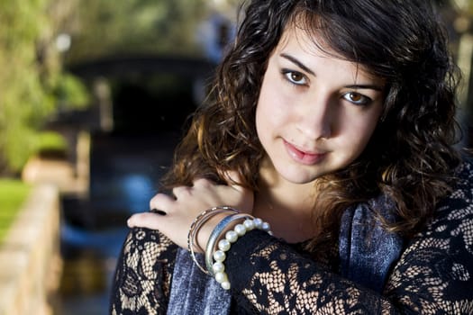 View of a beautiful girl on a urban park on a autumn set.