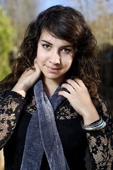 View of a beautiful girl on a urban park on a autumn set.