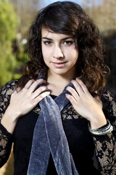 View of a beautiful girl on a urban park on a autumn set.