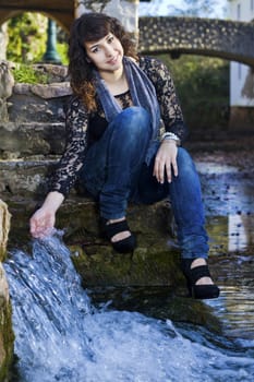 View of a beautiful girl on a urban park on a autumn set.