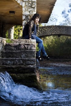 View of a beautiful girl on a urban park on a autumn set.