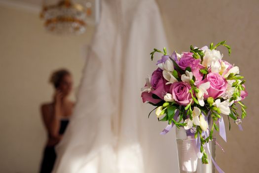 bride, bouquet of flowers and wedding dress