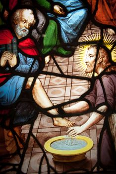 A close-up of a stained glass window depicting Jesus Christ