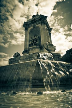 fountain square in Paris, France. monochrome image