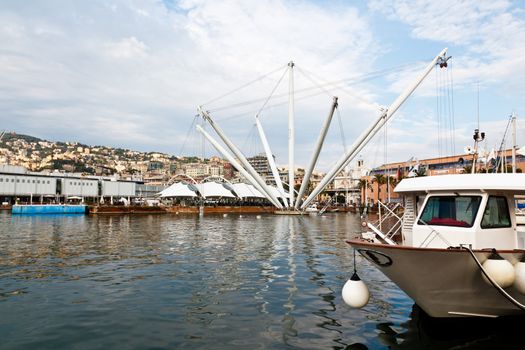 Genova Old Port Harbor with White Boat In a Cloudy Day, Italy