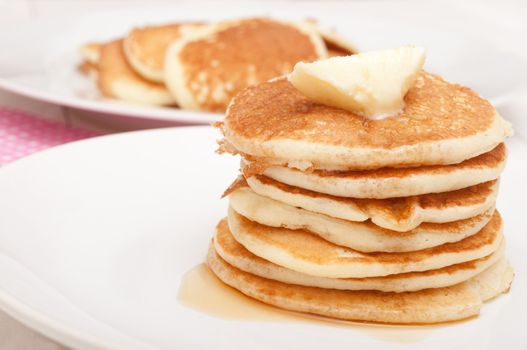Homemade Pancakes With Butter and Warm Maple Syrup 