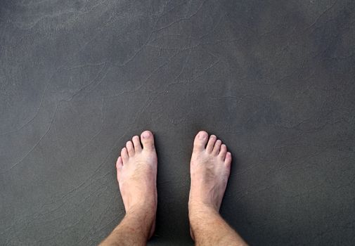 barefoot man on sea beach