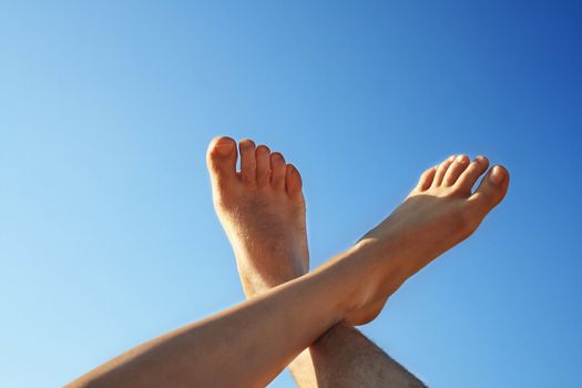 male and female foot high direction sky
