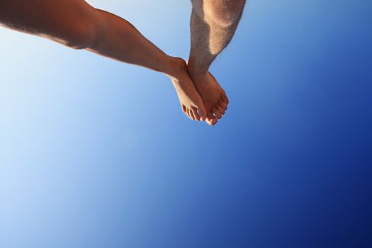 male and female foot high direction sky