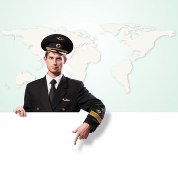 pilot in the form of holding an empty billboard on the background of map of the world, place for text