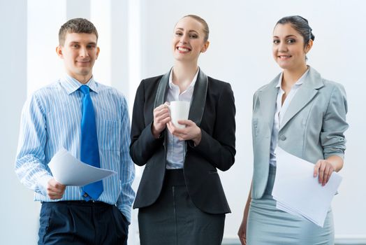 group of business people discussing documents in the office