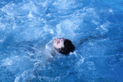 young attractive man relax in spa area