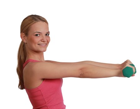 Portrait of a young blonde woman doing exercise with dumbbells isolated against a white background.